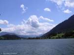 Die Sonne scheint wieder über dem Großen Alpsee, während hinten rund um das Illertal noch die Woken vorherrschen (Oberallgäu - Sommer 2008)